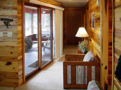 Iris' Place Cabin hallway to screened porch area.